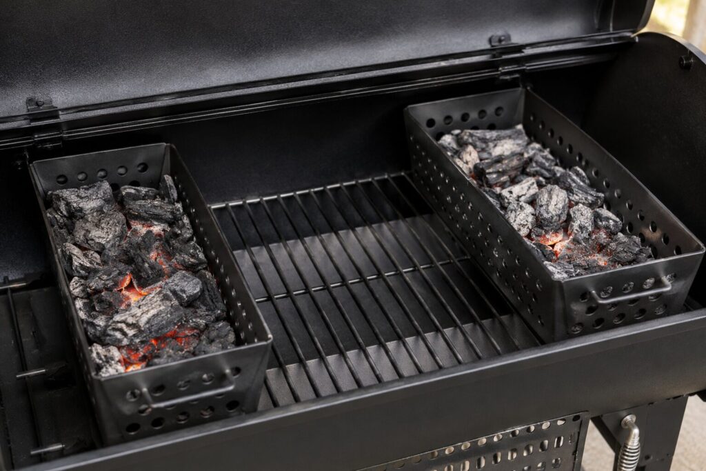 Heavy-duty steel charcoal fuel baskets arranged inside the chamber for efficient airflow management.