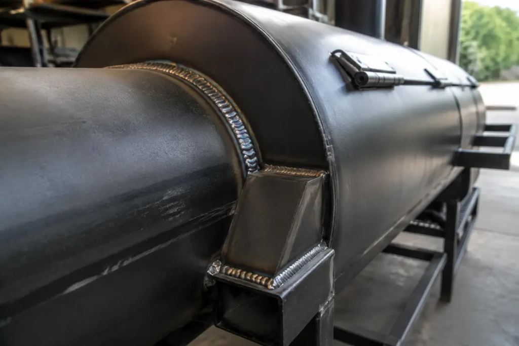 Close-up of steel welds on offset smoker body