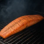 Smoked salmon fillet cooking on an offset smoker
