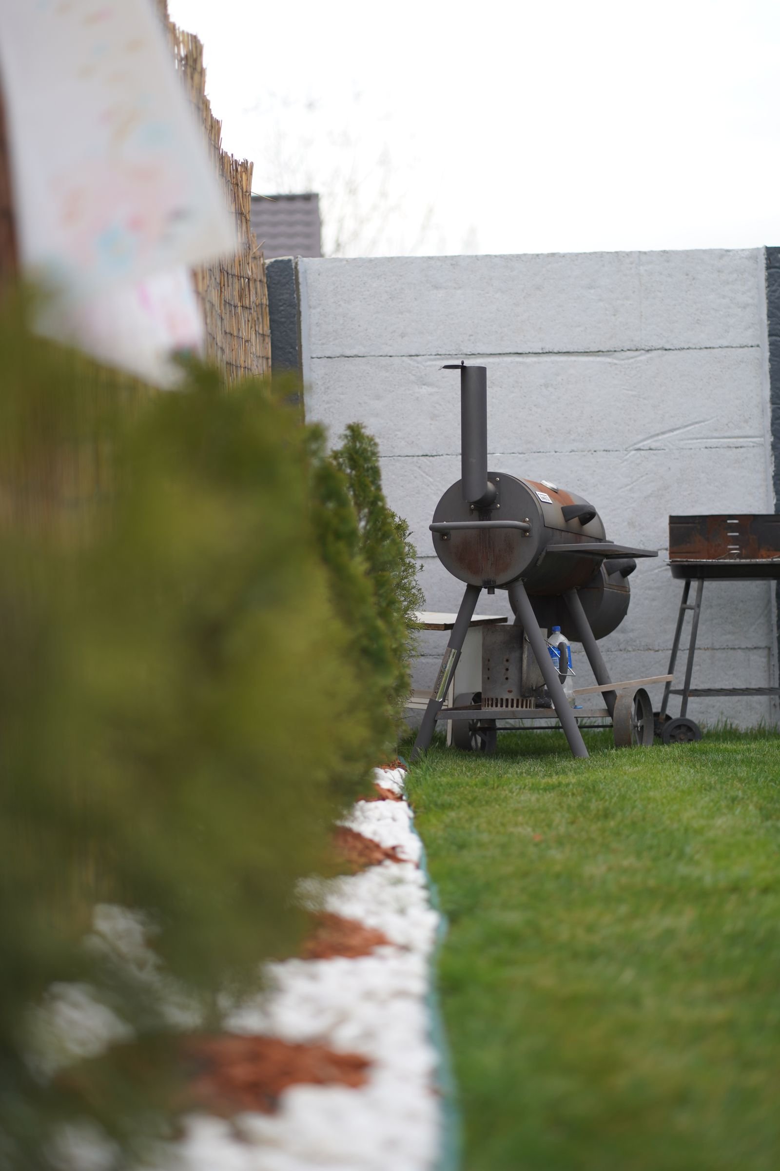 Offset smoker in a backyard